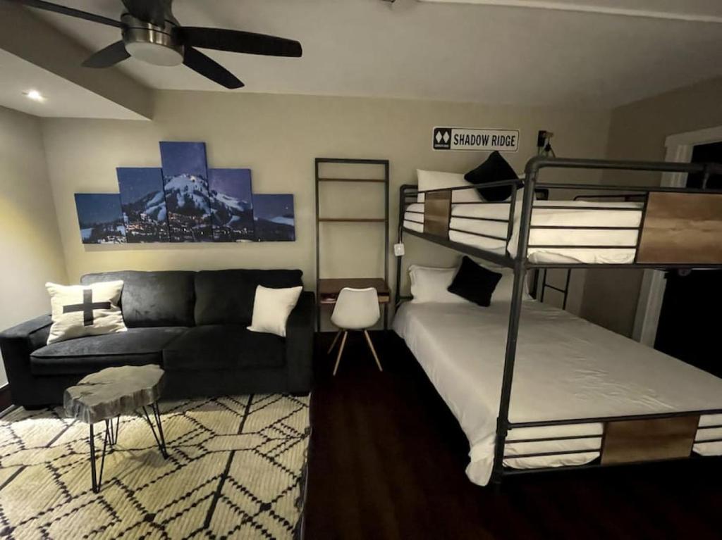 a bedroom with a bunk bed and a couch at Luxe Park City Mountain Resort Studio in Park City