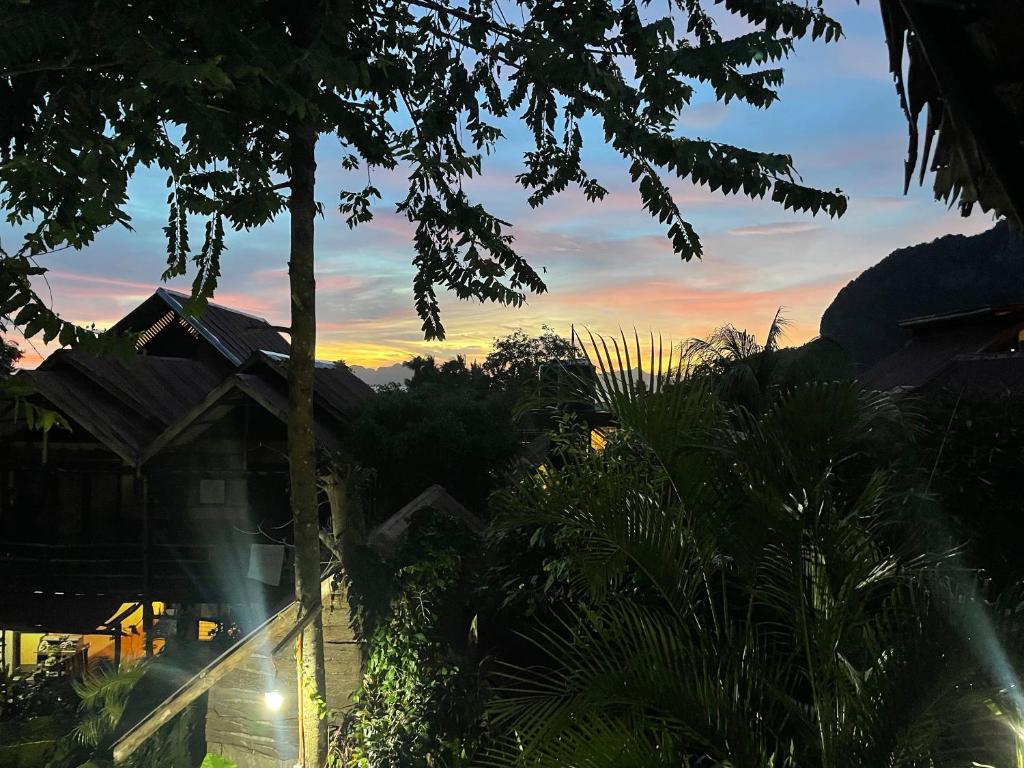 a view of the sunset from a house at Novie's Tourist Inn in El Nido
