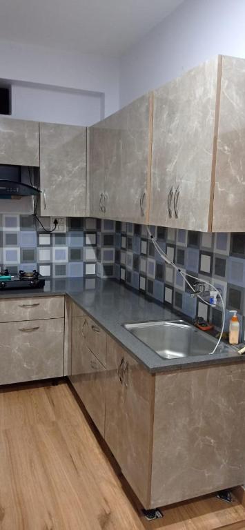 Kuchyň nebo kuchyňský kout v ubytování Crescent Moon Homestay