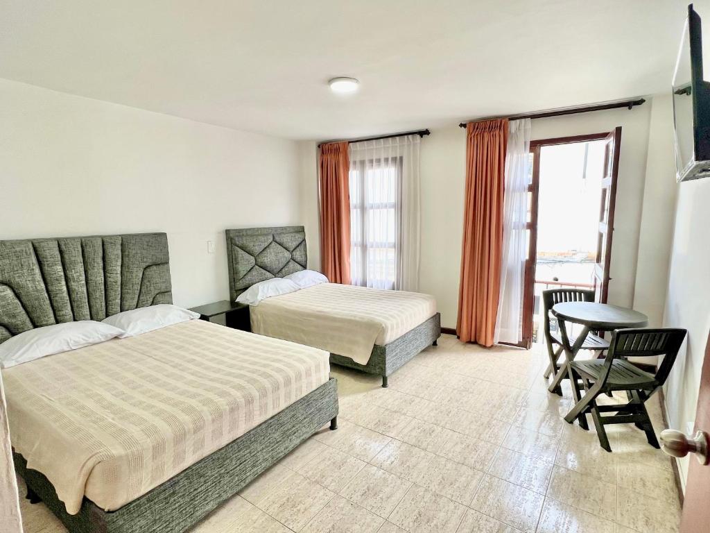 Postel nebo postele na pokoji v ubytování Hotel Dorado Real HDR