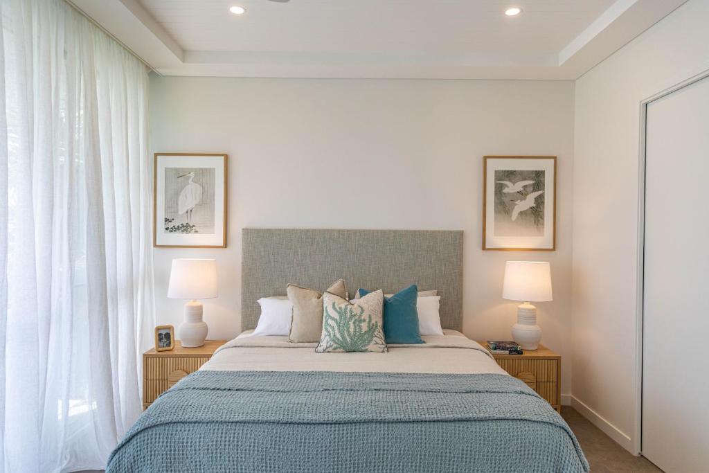 Postel nebo postele na pokoji v ubytování Escape Villas Port Douglas