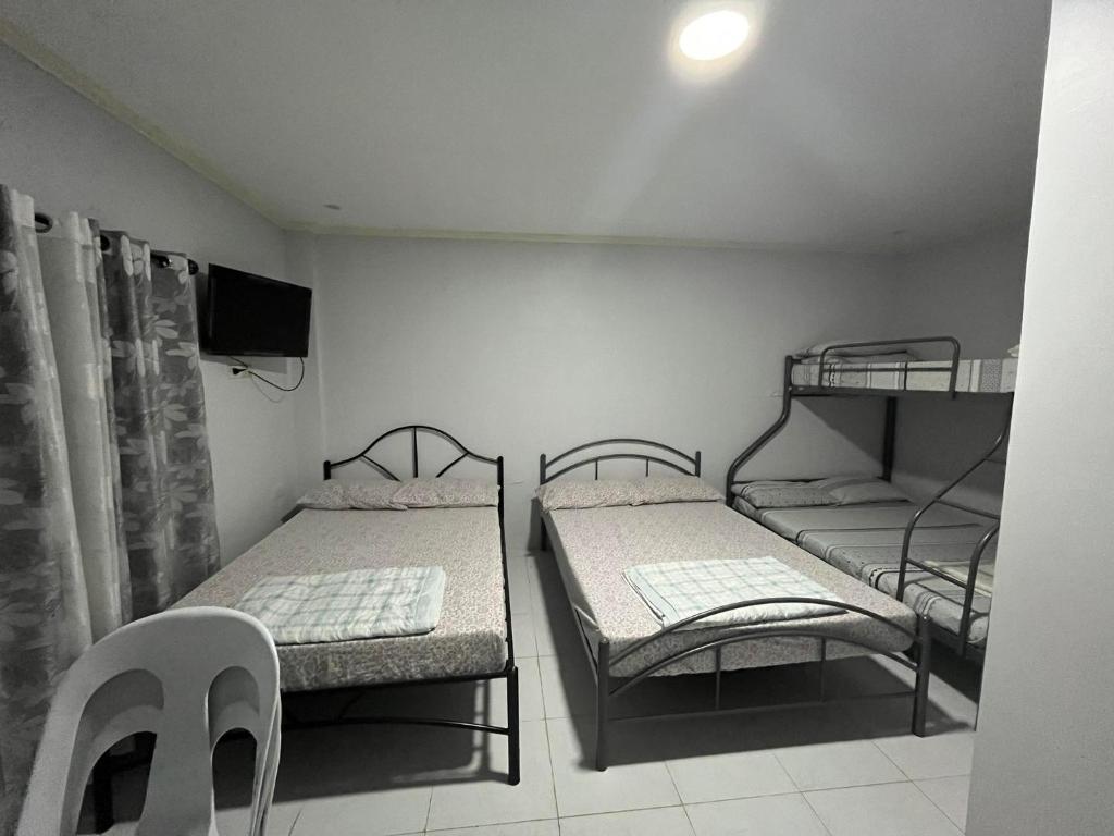 Postel nebo postele na pokoji v ubytování Nolina's Transient Rooms - Alaminos, Pangasinan