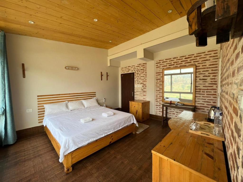 Postel nebo postele na pokoji v ubytování Hills and Horizon Resort