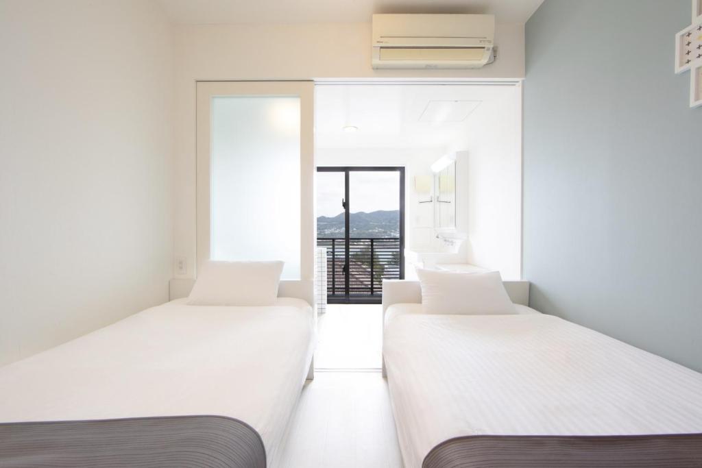 Un pat sau paturi într-o cameră la E-horizon Resort Condominium Sesoko - Vacation STAY 92901v