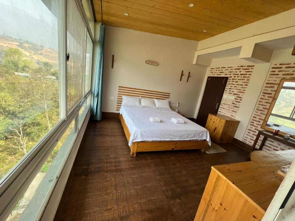 Postel nebo postele na pokoji v ubytování Hills and Horizon Resort