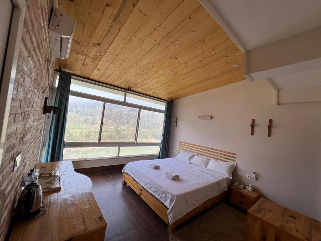 Postel nebo postele na pokoji v ubytování Hills and Horizon Resort