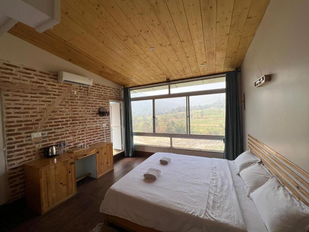 Postel nebo postele na pokoji v ubytování Hills and Horizon Resort