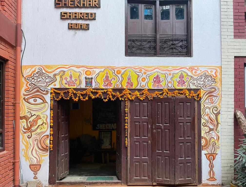 an entrance to a store with two brown doors at Shekhar's Shared Home in Bhaktapur