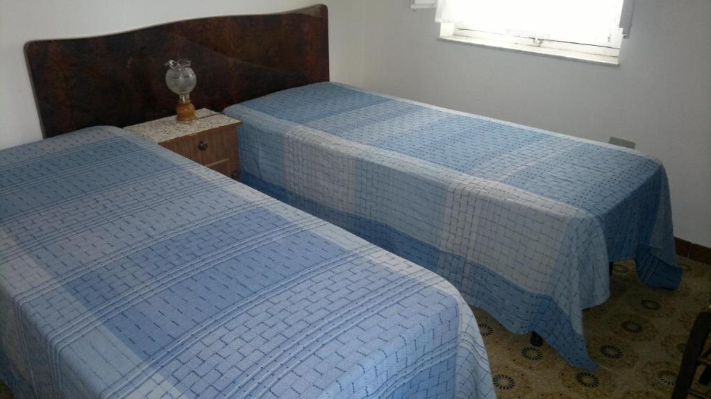 Łóżko lub łóżka w pokoju w obiekcie Casa Salvaggio