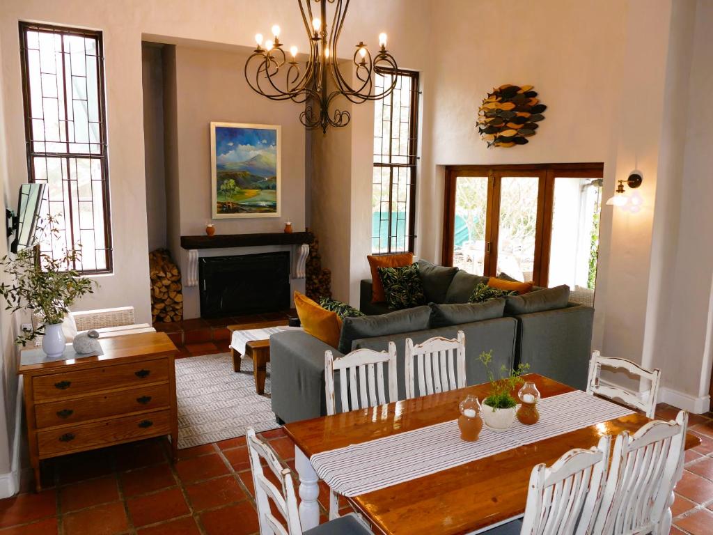 a living room with a couch and a table at Abundance in Riebeek in Riebeek-Kasteel
