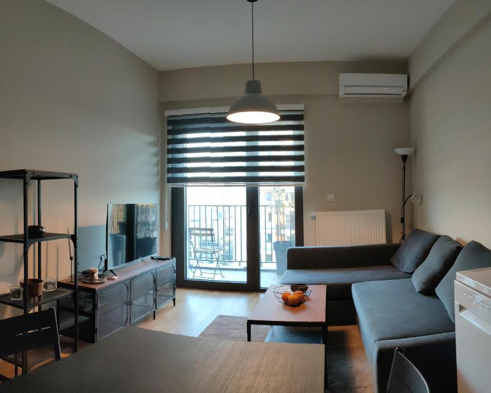 a living room with a couch and a table at Diamond Apartment 158- Luxury in Skopje in Skopje