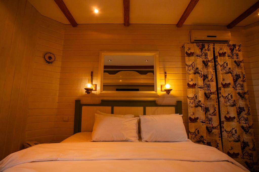 Postel nebo postele na pokoji v ubytování Piazza Boutique Hotel