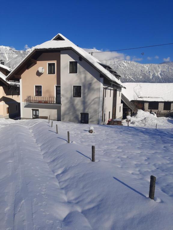 a snow covered yard in front of a house at Haus Nampolach 