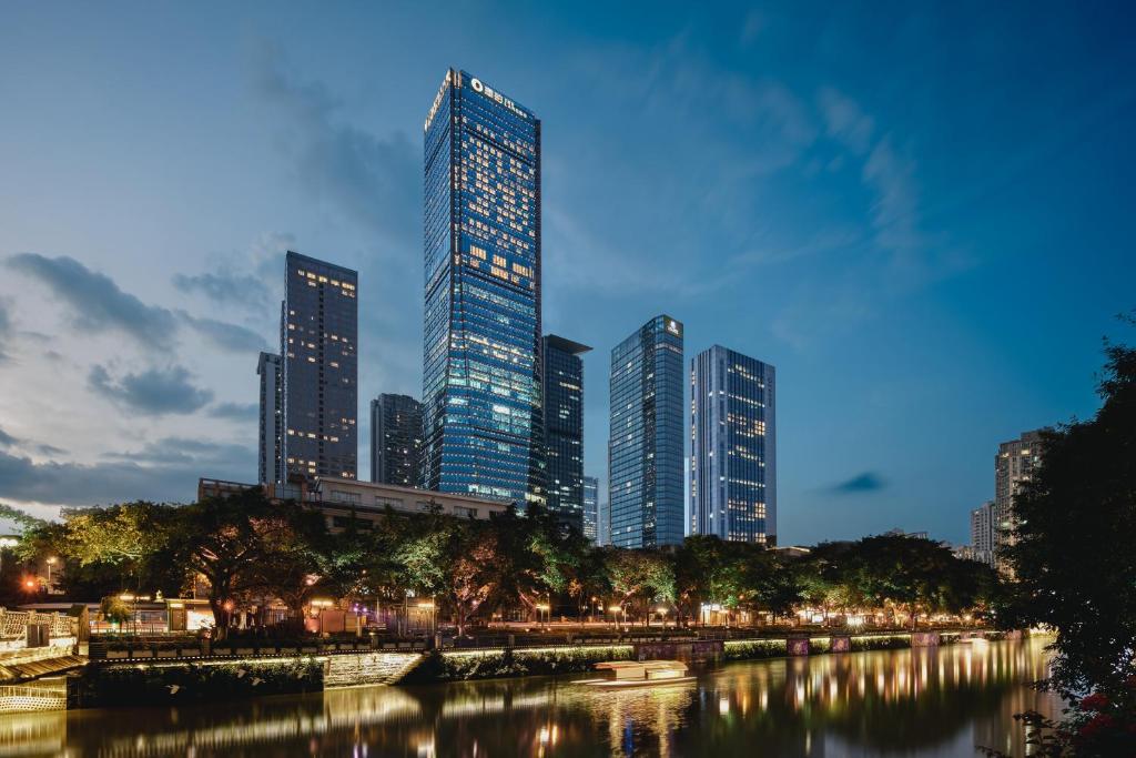 a city skyline with tall buildings and a river at The Langbo Chengdu, in The Unbound Collection by Hyatt in Chengdu