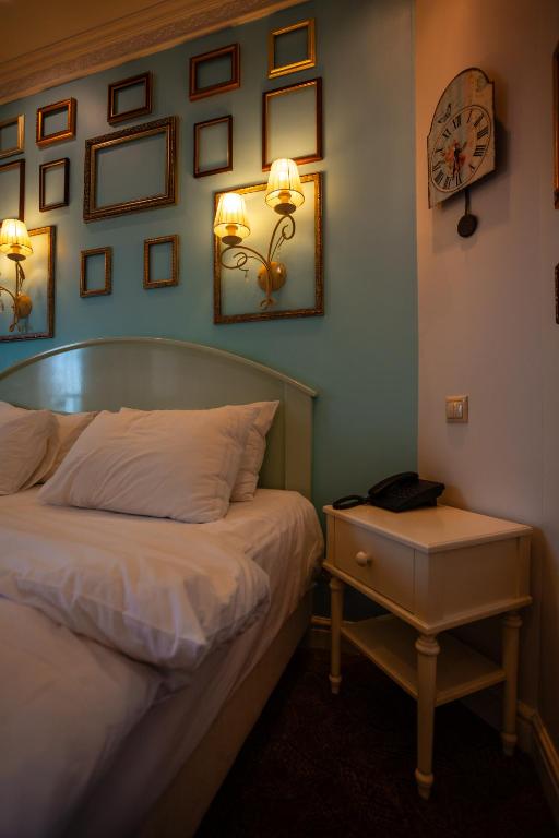 Postel nebo postele na pokoji v ubytování Piazza Boutique Hotel