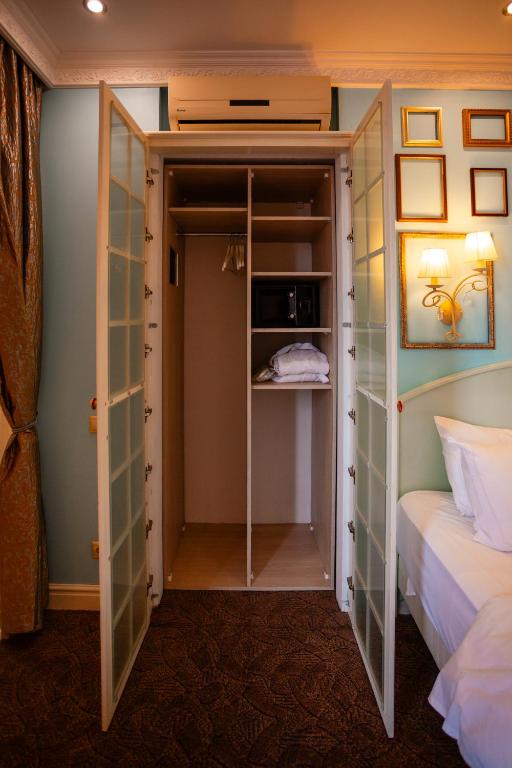 Postel nebo postele na pokoji v ubytování Piazza Boutique Hotel