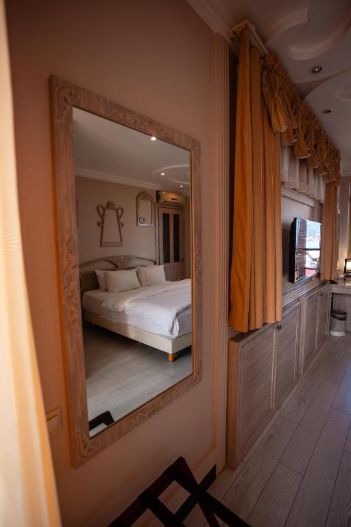 Postel nebo postele na pokoji v ubytování Piazza Boutique Hotel