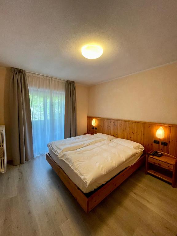 Postel nebo postele na pokoji v ubytování Hotel Gembro