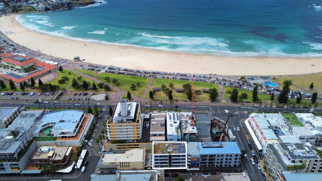 an aerial view of a beach and the ocean at EIGHT TWO NINE TWO IV: BONDI BEACH in Sydney