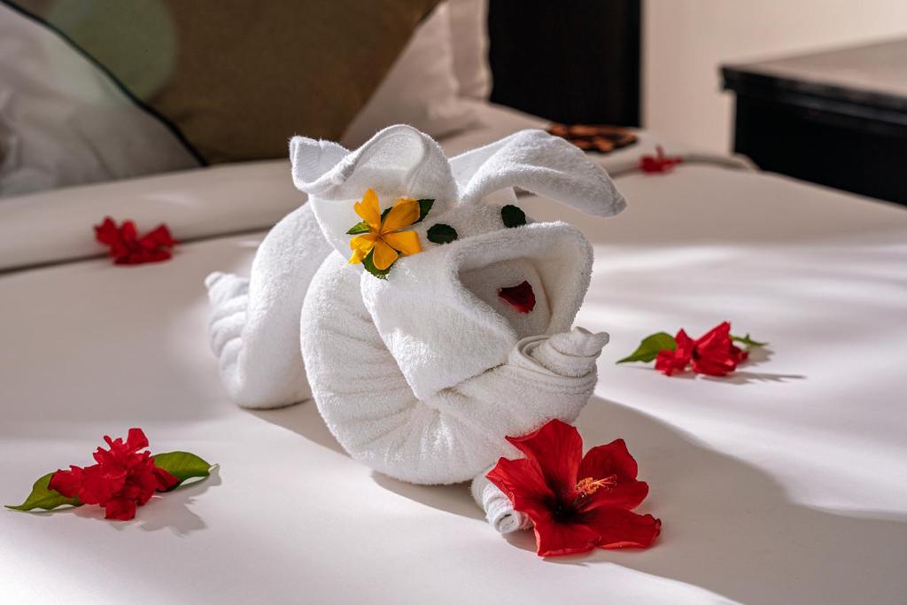 Postel nebo postele na pokoji v ubytování Koi Resort & Spa Hoi An