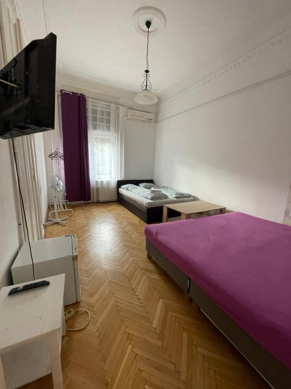 Postel nebo postele na pokoji v ubytování White Pearl Rooms near Gozsdu
