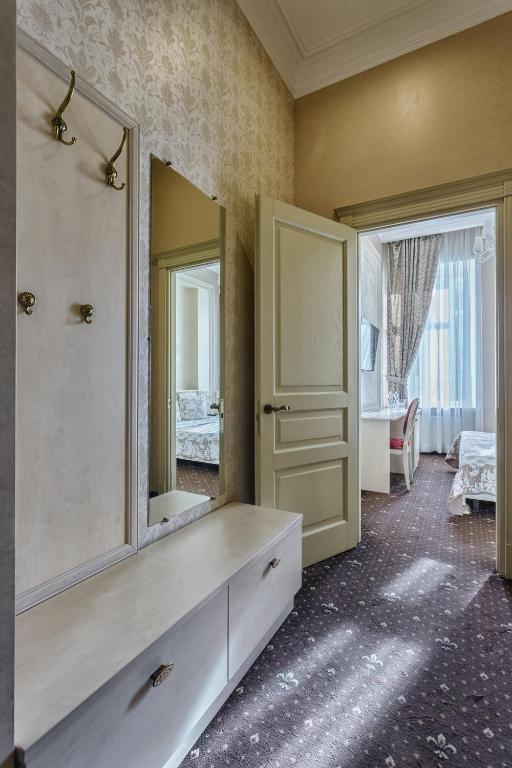 Postel nebo postele na pokoji v ubytování Vintage Art Hotel