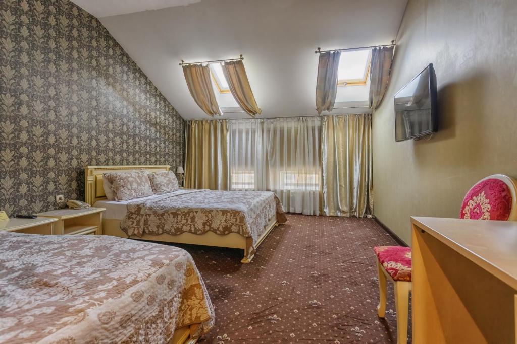 Postel nebo postele na pokoji v ubytování Vintage Art Hotel