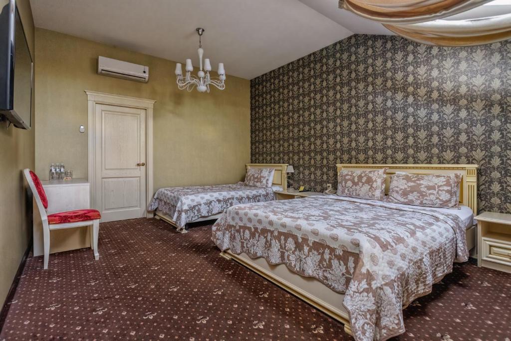 Postel nebo postele na pokoji v ubytování Vintage Art Hotel