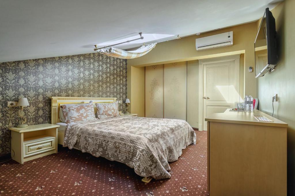 Postel nebo postele na pokoji v ubytování Vintage Art Hotel