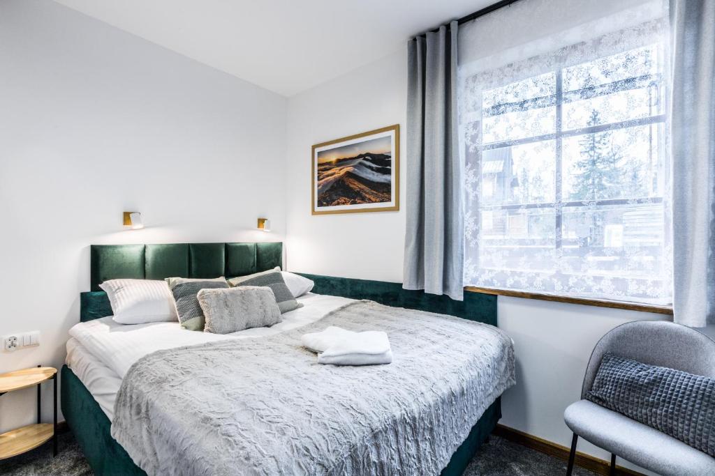 Posteľ alebo postele v izbe v ubytovaní Aparthotel Lucylla