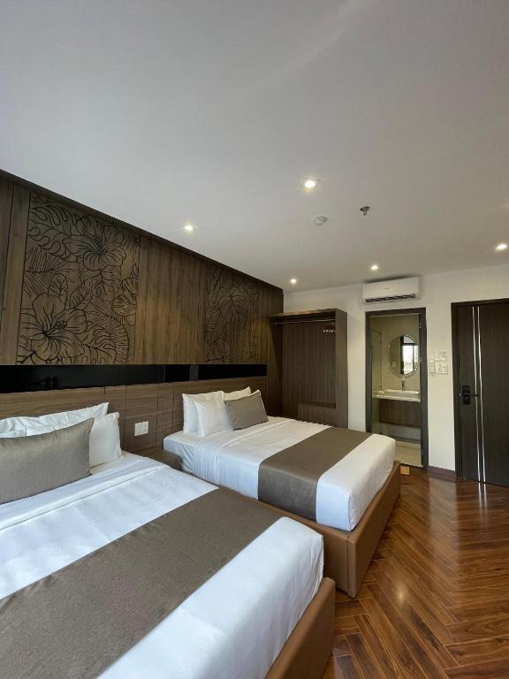 Giường trong phòng chung tại Hải Long Hotel 2