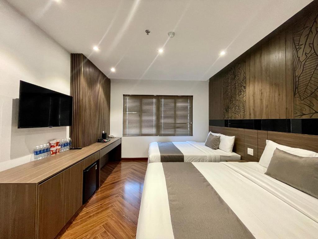 Giường trong phòng chung tại Hải Long Hotel 2