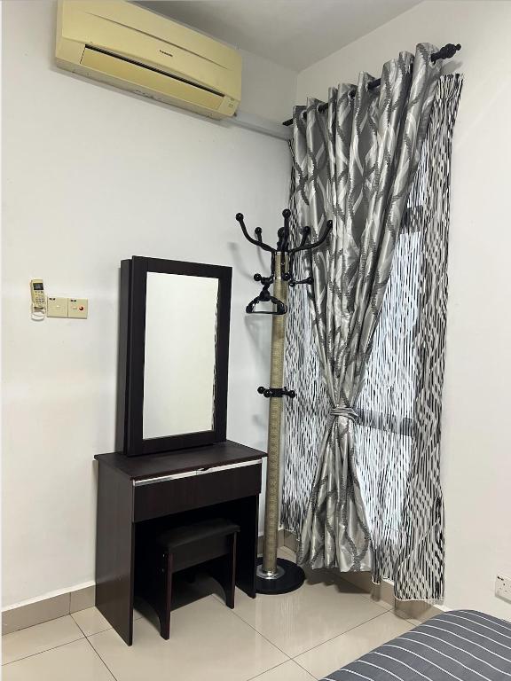 Postel nebo postele na pokoji v ubytování KBCC Service Apartment Homestay