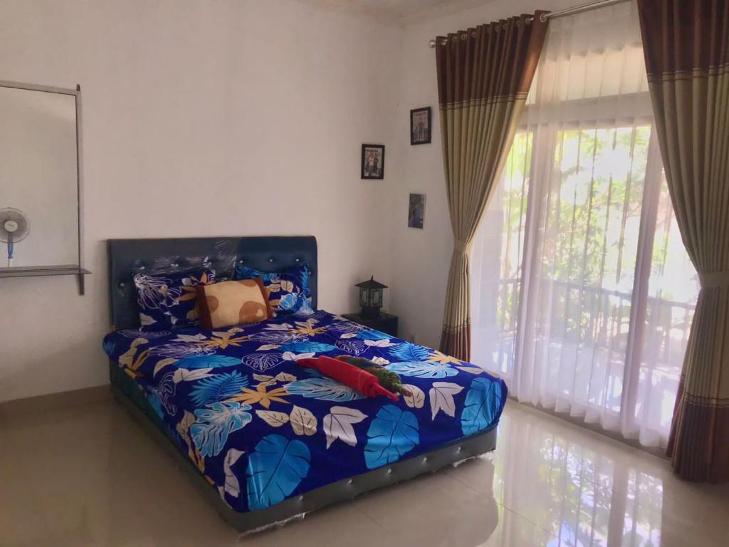 מיטה או מיטות בחדר ב-Adi Guest house