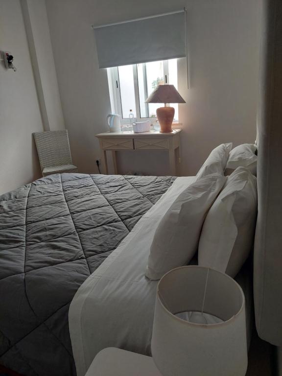 Letto o letti in una camera di Vivenda Rosa Lagos