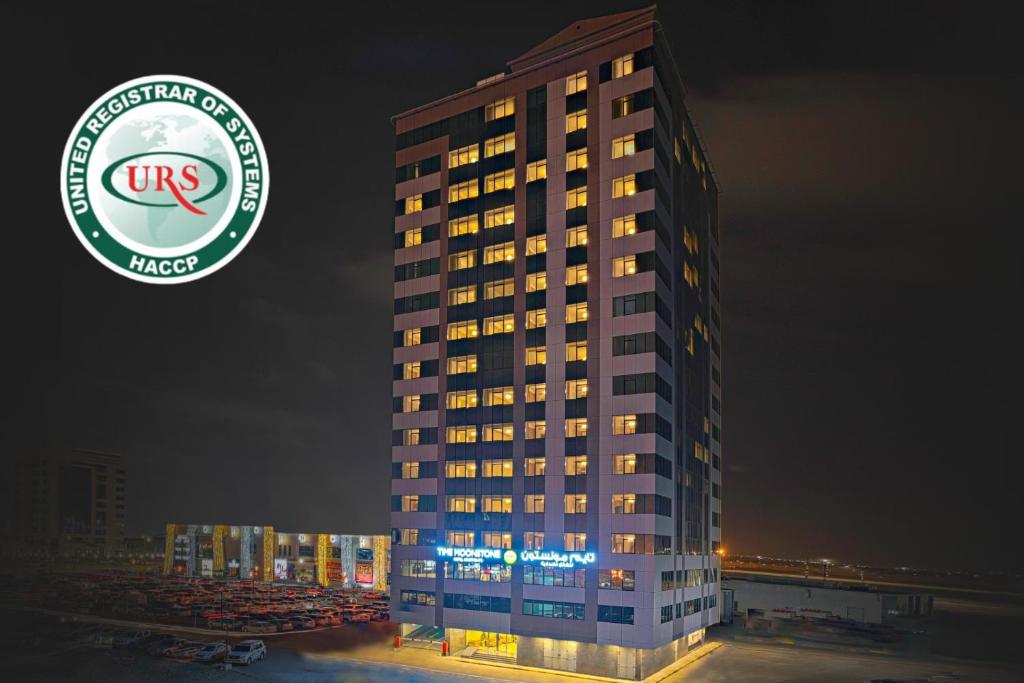 a building with a sign on the side of it at TIME Moonstone Hotel Apartments in Fujairah