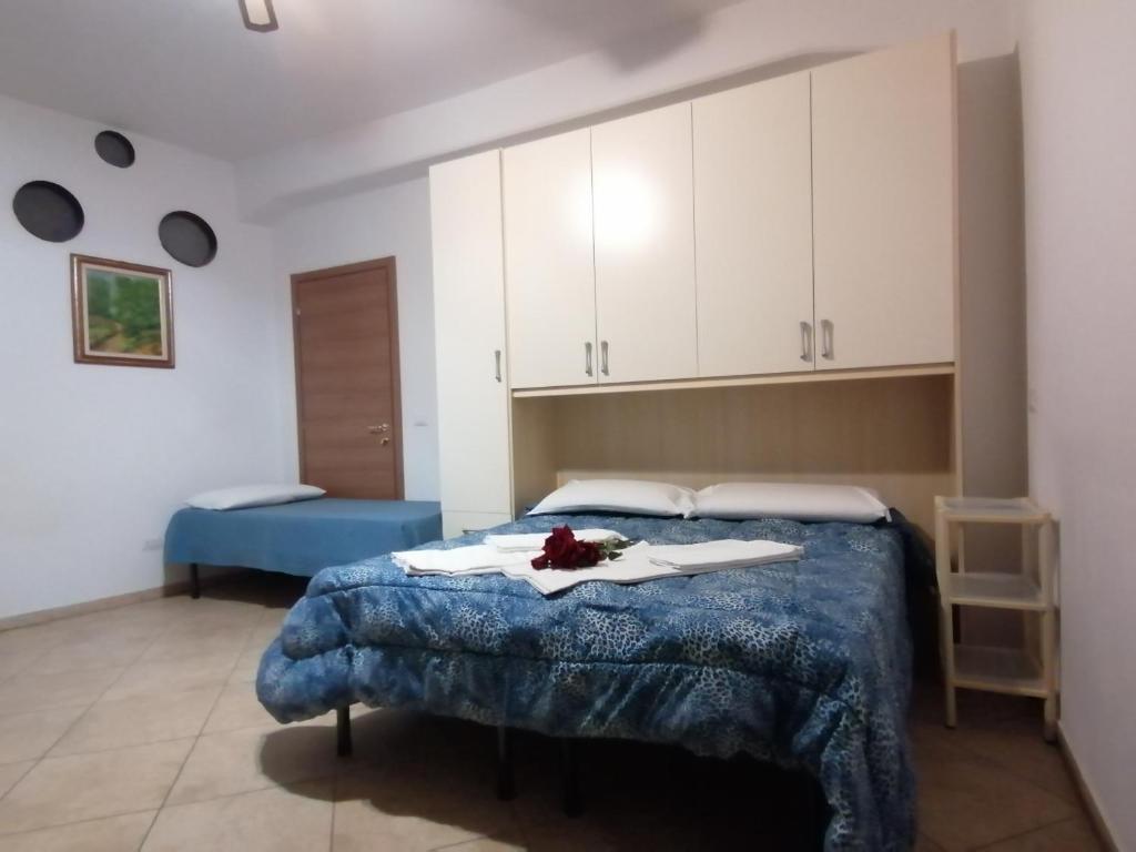 Posteľ alebo postele v izbe v ubytovaní Villa Glori affitto camere monolocali