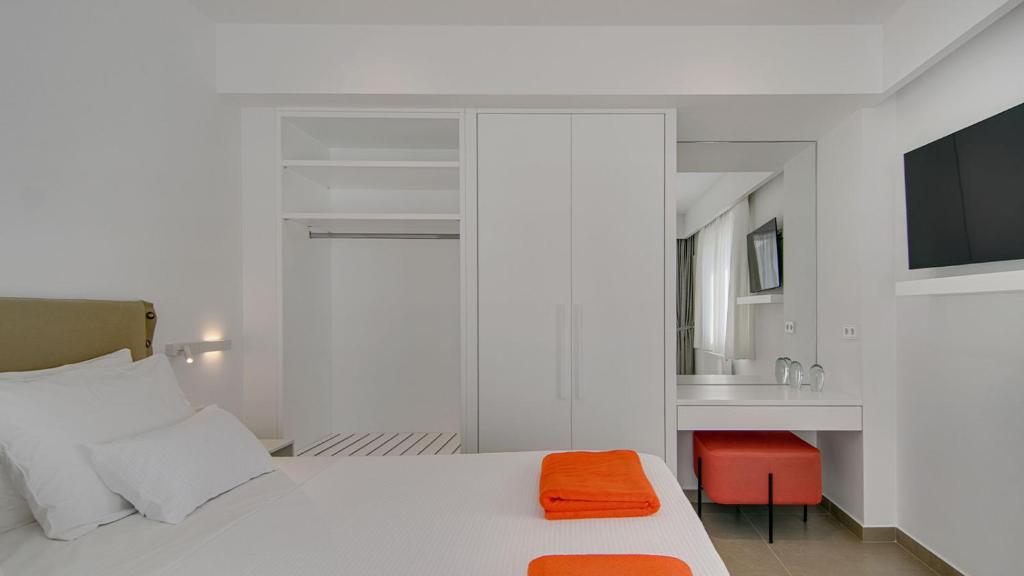 Postel nebo postele na pokoji v ubytování LIVINGHOME SUITES