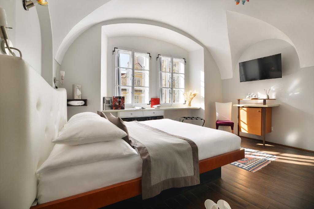 Postel nebo postele na pokoji v ubytování Design Hotel Neruda
