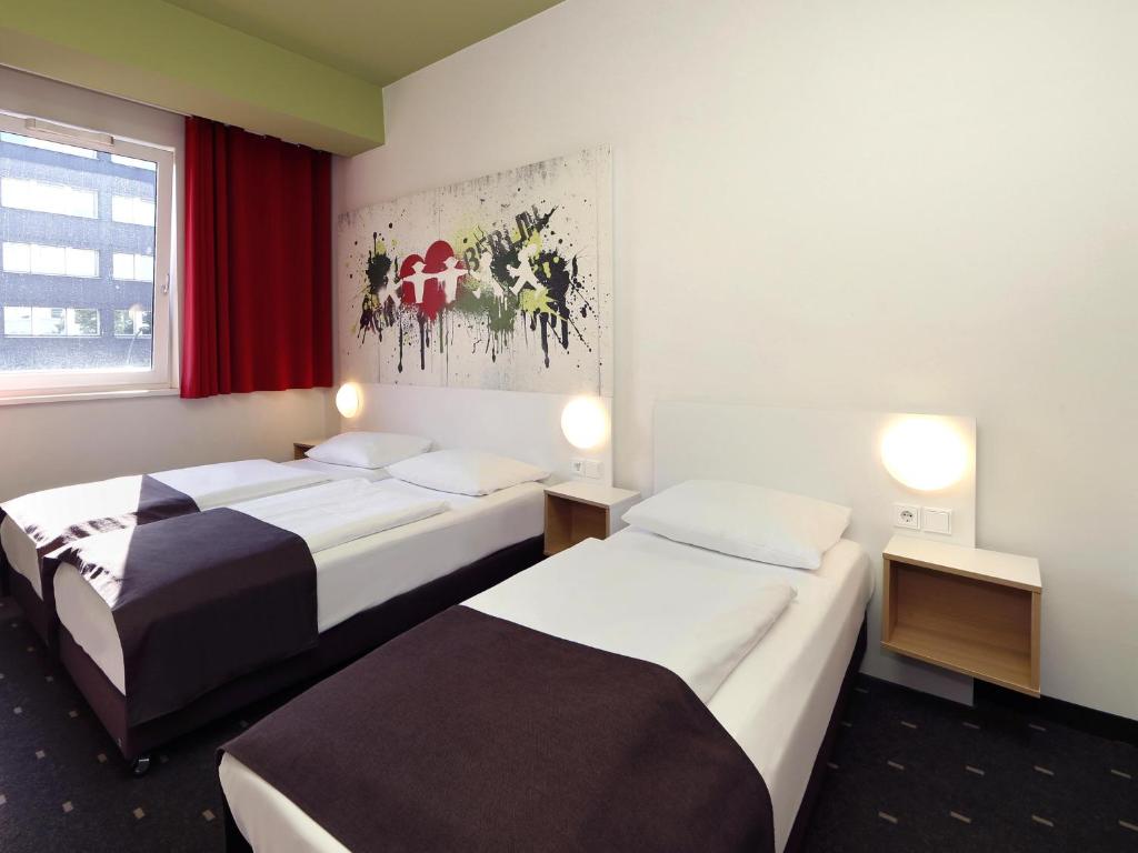 Postel nebo postele na pokoji v ubytování B&B HOTEL Berlin-Potsdamer Platz