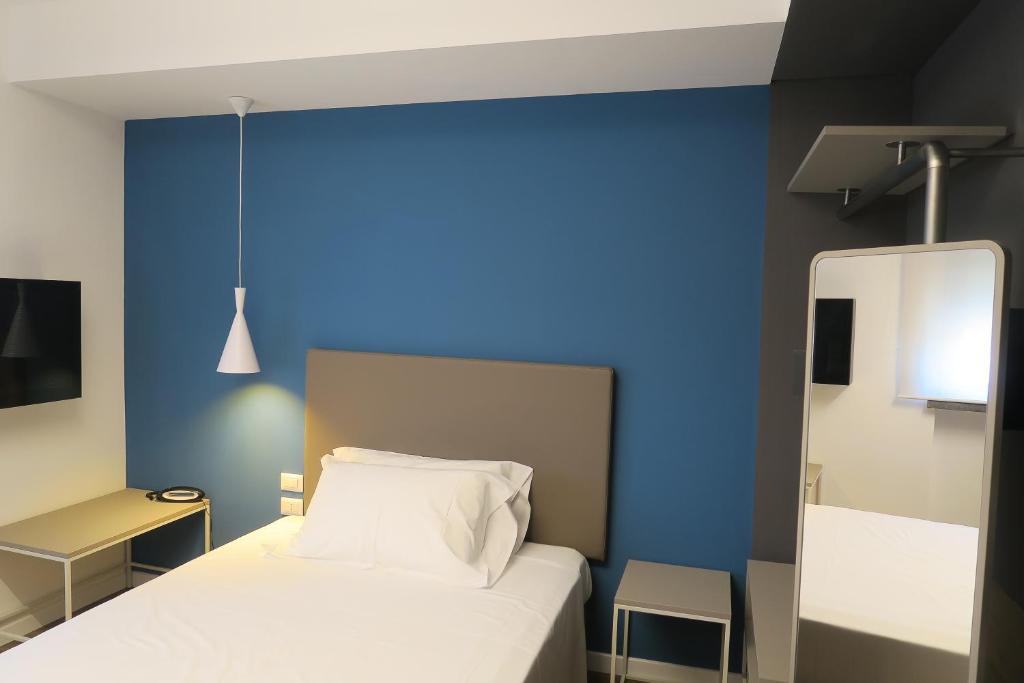 Postel nebo postele na pokoji v ubytování Best Western Hotel Corsi