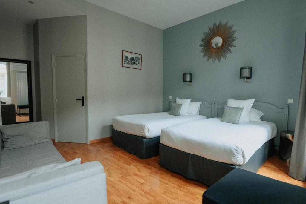 Postel nebo postele na pokoji v ubytování Hotel Albert 1er