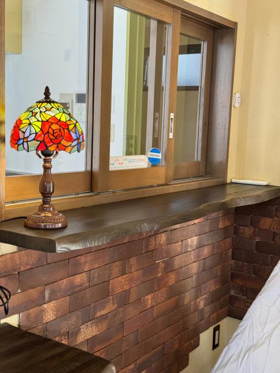 Postel nebo postele na pokoji v ubytování PAThouse台东区店