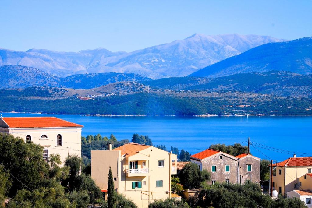 a town with a view of a lake and mountains at Bakers House in Gimari