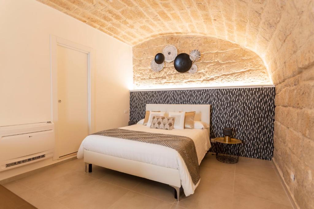 Postel nebo postele na pokoji v ubytování B&B Torre Canina suite & rooms