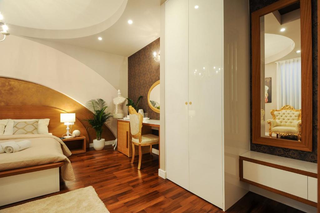 Posteľ alebo postele v izbe v ubytovaní Silver & Gold Luxury Rooms