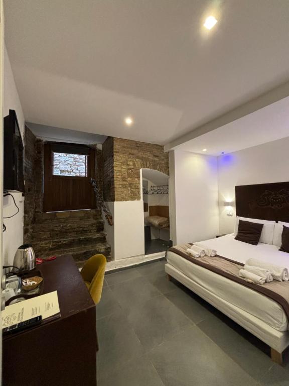 Postel nebo postele na pokoji v ubytování Hotel Assisivm Antica Dimora AD