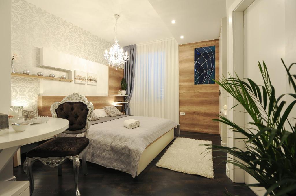 Posteľ alebo postele v izbe v ubytovaní Silver & Gold Luxury Rooms