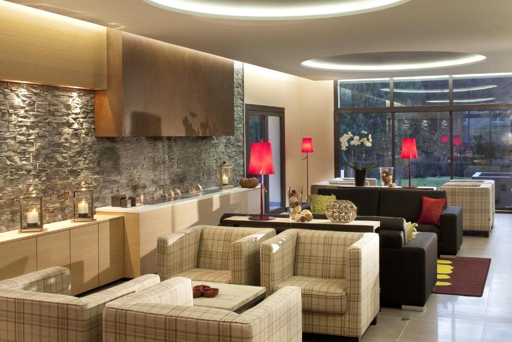 Posezení v ubytování L'Aubinière Hôtel Restaurant & Spa