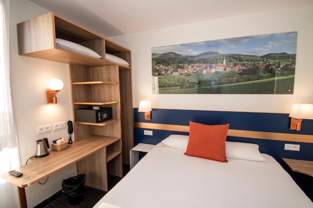 Postel nebo postele na pokoji v ubytování K Hotel